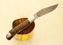Slimline trapper in Dinosaur Bone with Stainless damascus