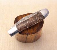 Slimline trapper in Dinosaur Bone with Stainless damascus